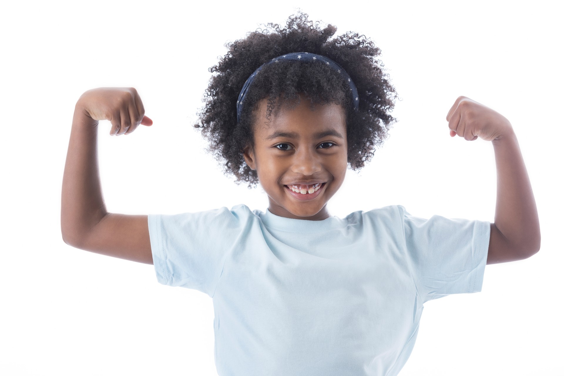 Confident young girl flexes her muscles